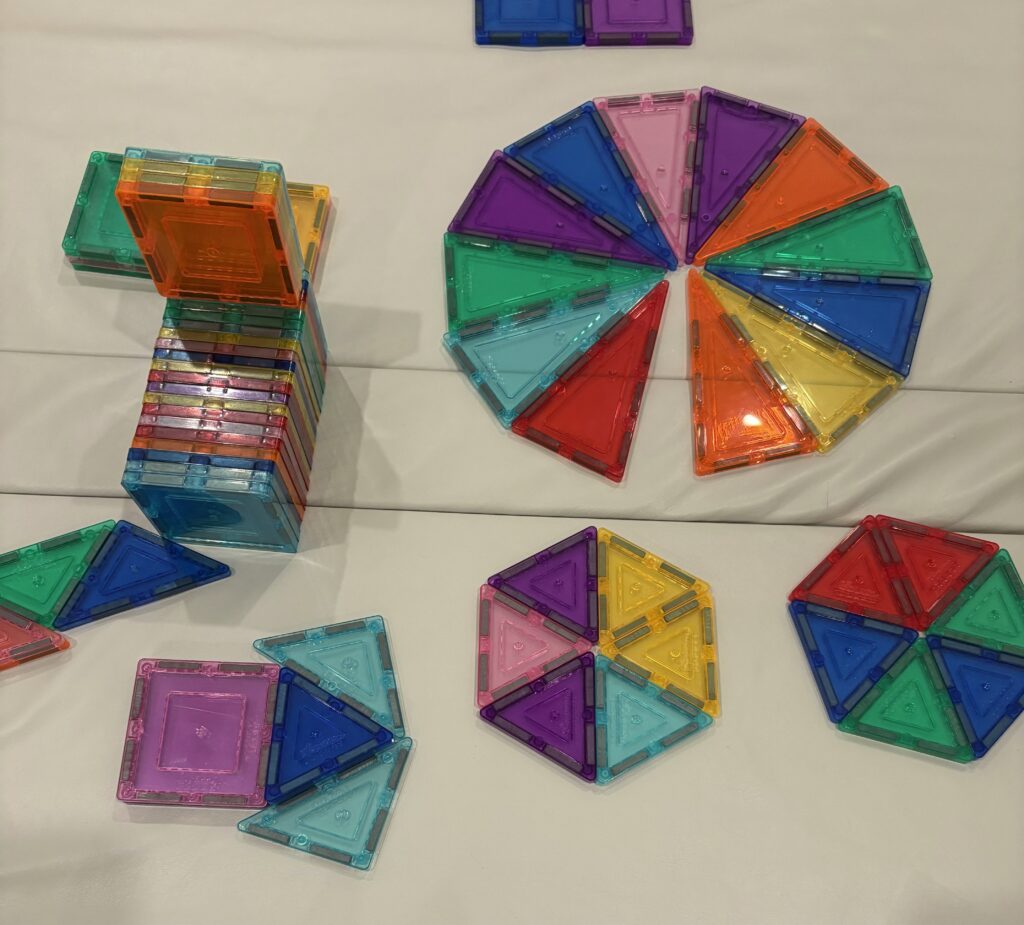 3 year old building a structure with PicassoTiles magnetic tiles
