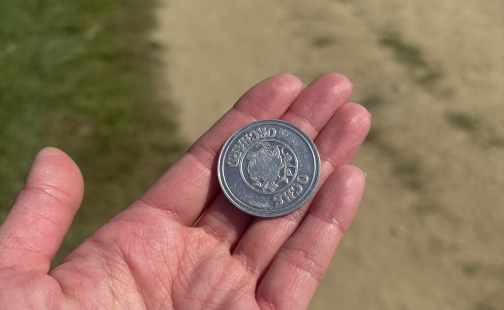 Ochs Orchard silver coin for $3 produce credit